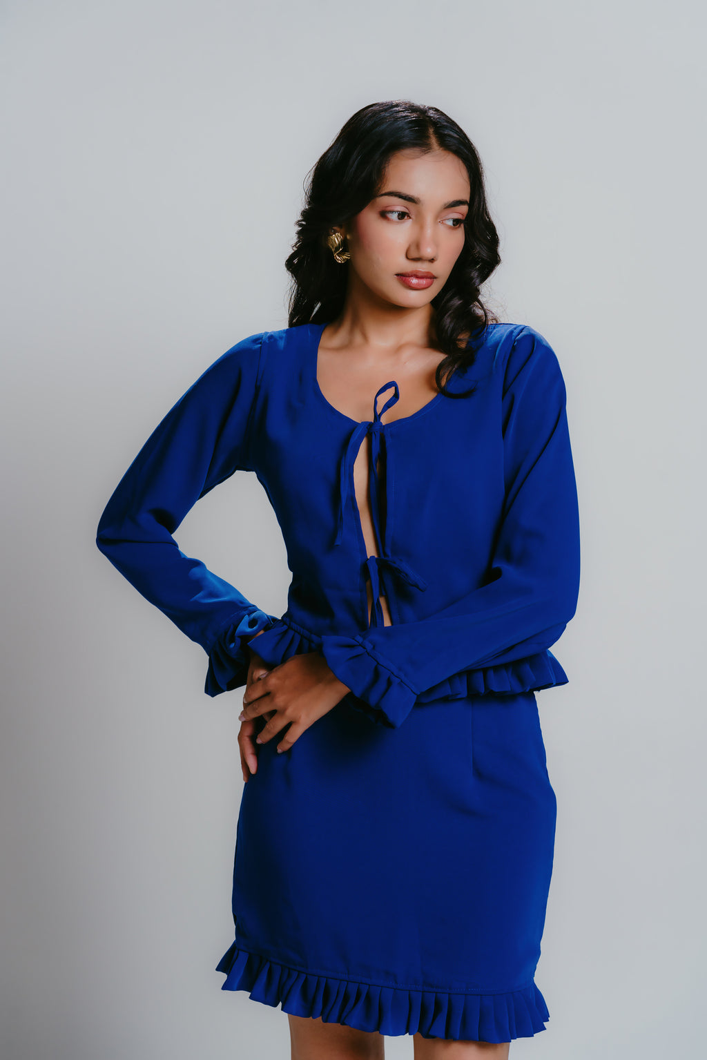 Blue smock top with pleats and tie-up details