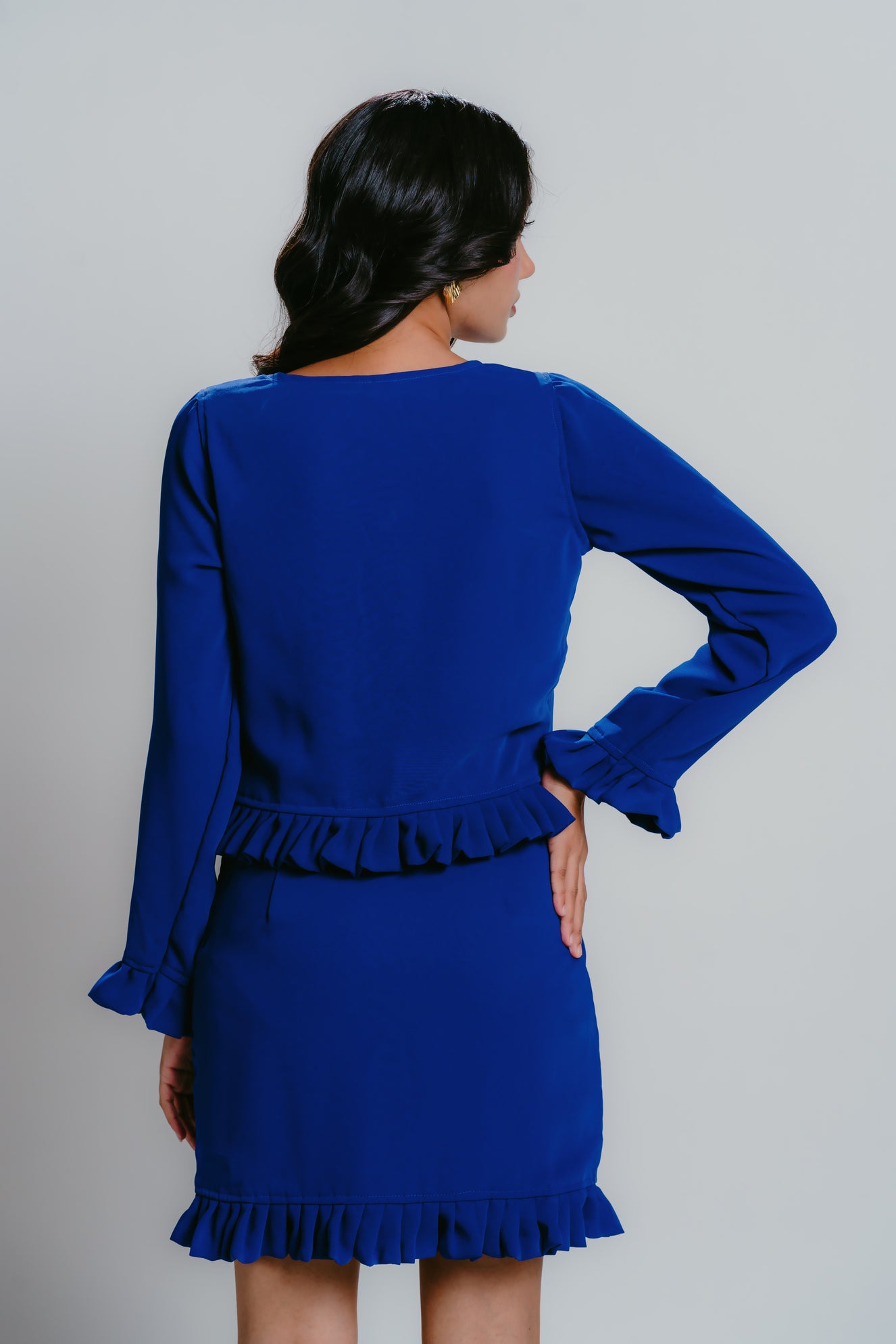 Blue smock top with pleats and tie-up details