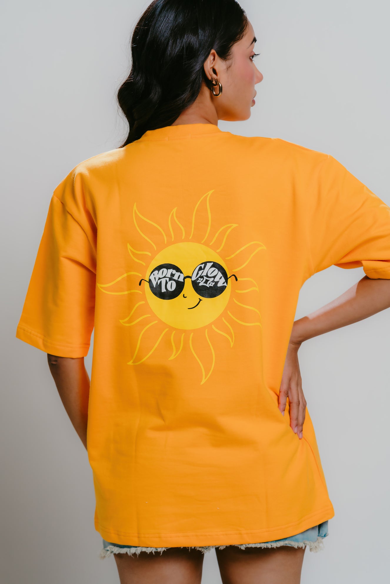 Unisex orange t-shirt with graphics and puff printing at the back