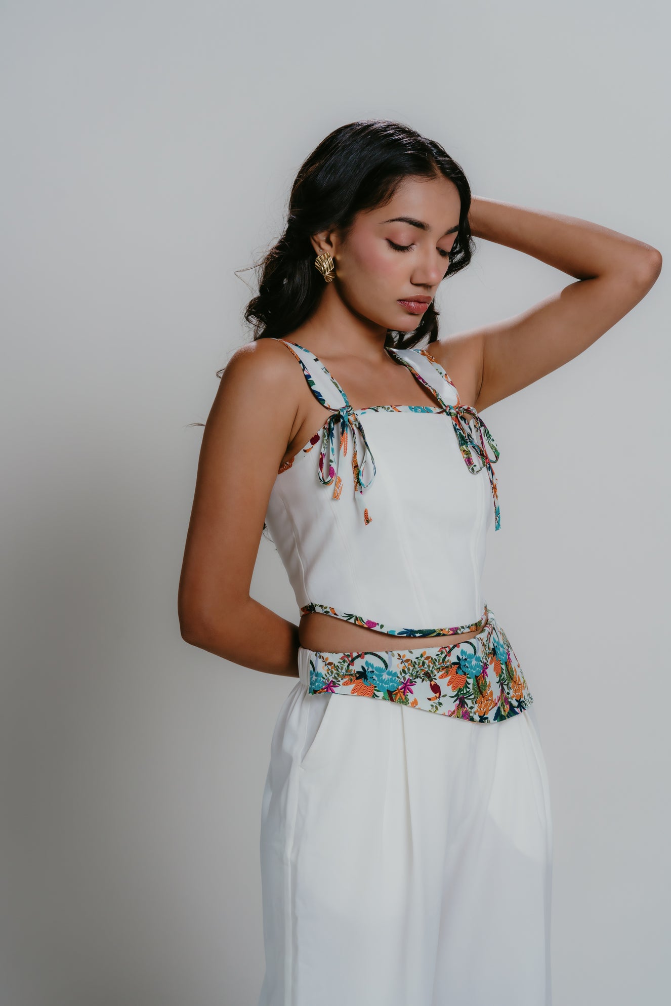 White pants with print details along with matching print detail corset