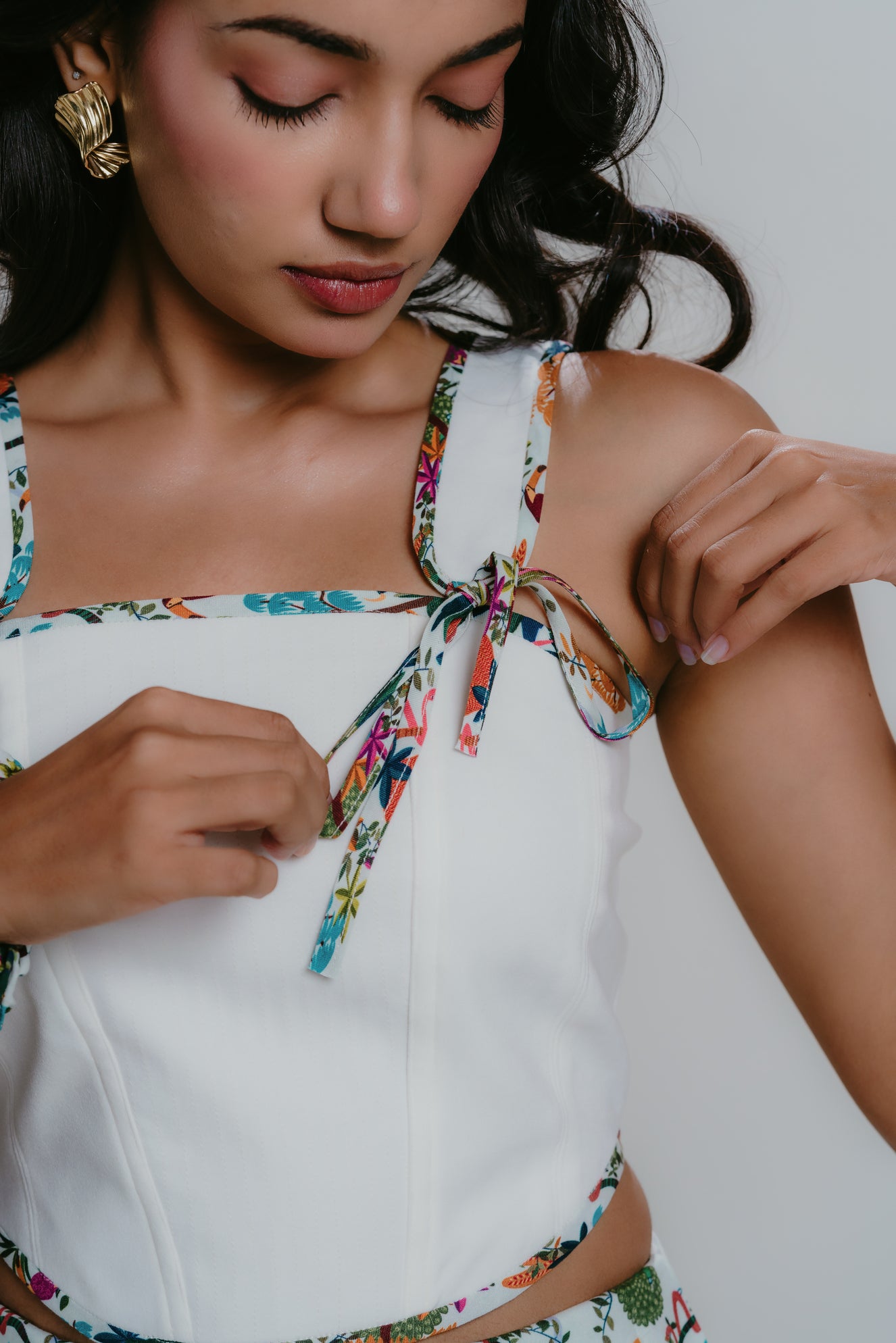 Print tie-up detail on white corset