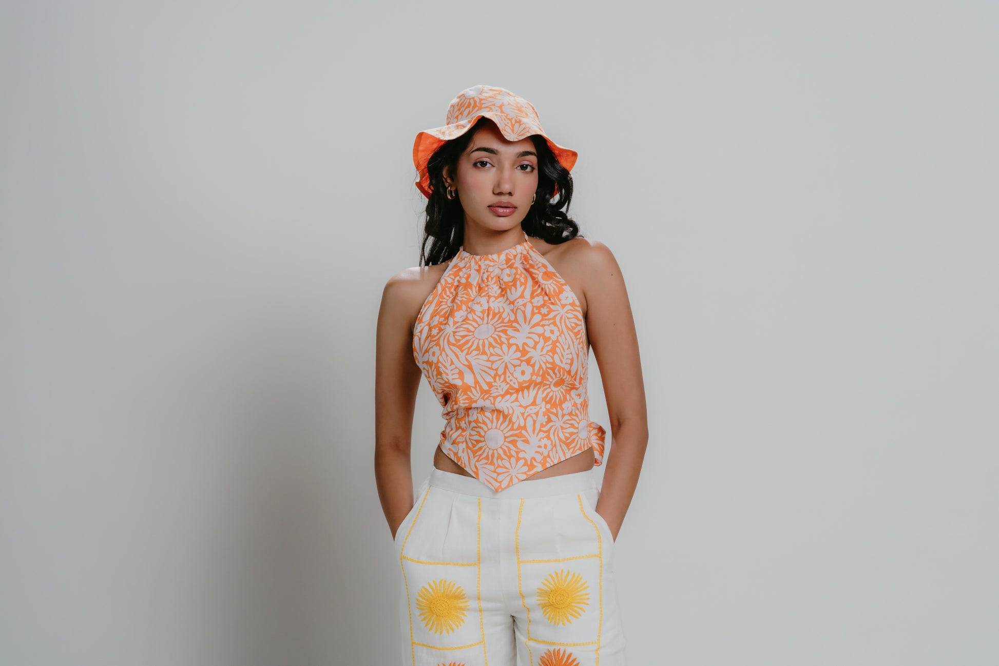 Orange and white floral printed bucket hat with matching print bandana top
