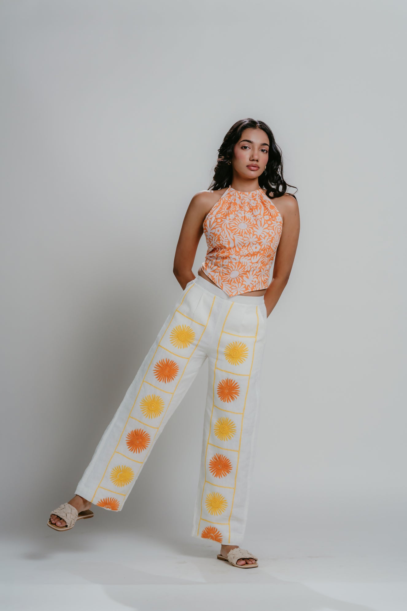 Linen pants with orange and yellow floral patterns