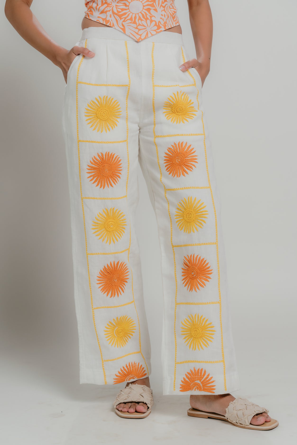 Linen pants with orange and yellow floral patterns