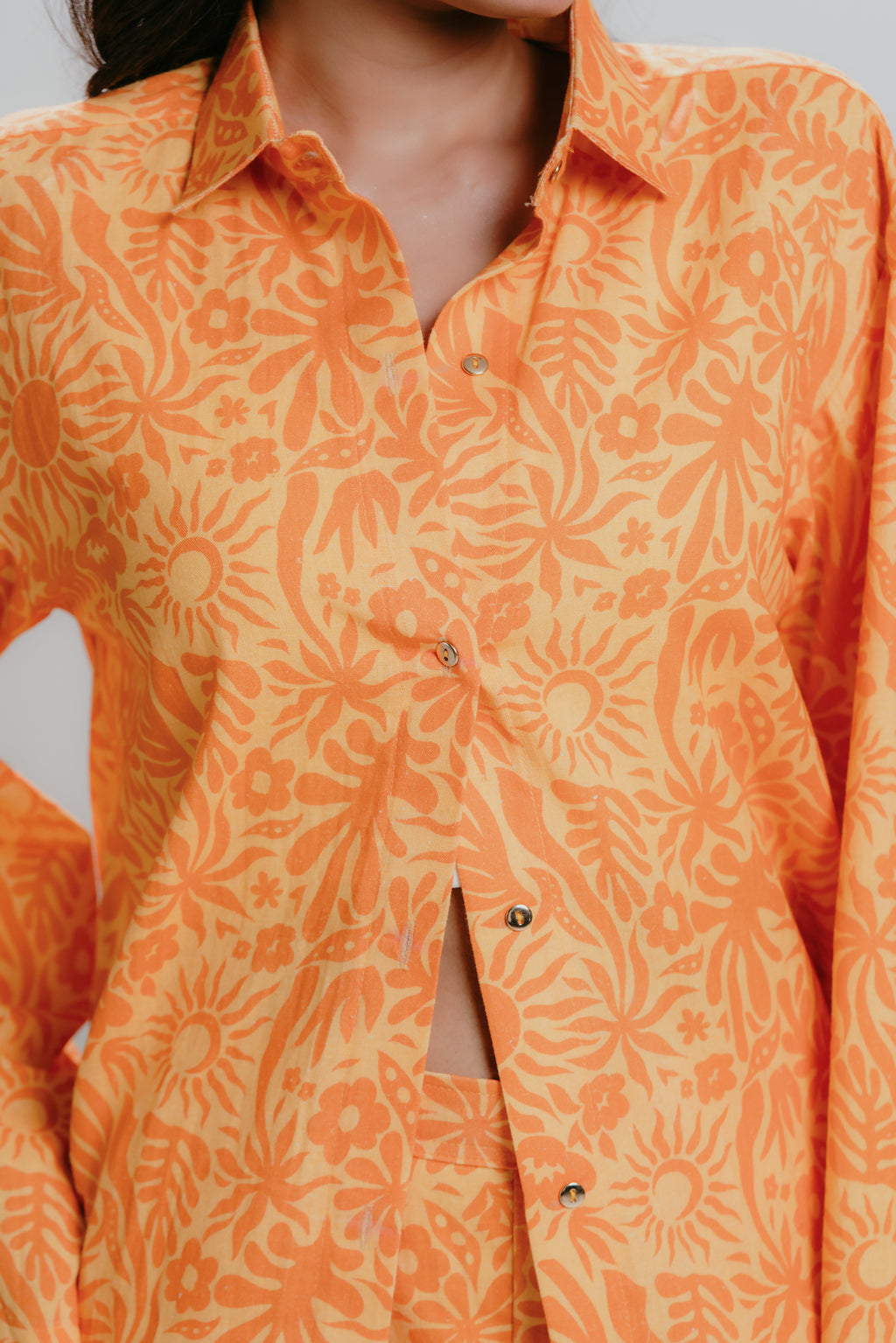 Orange printed shirt with gold button details