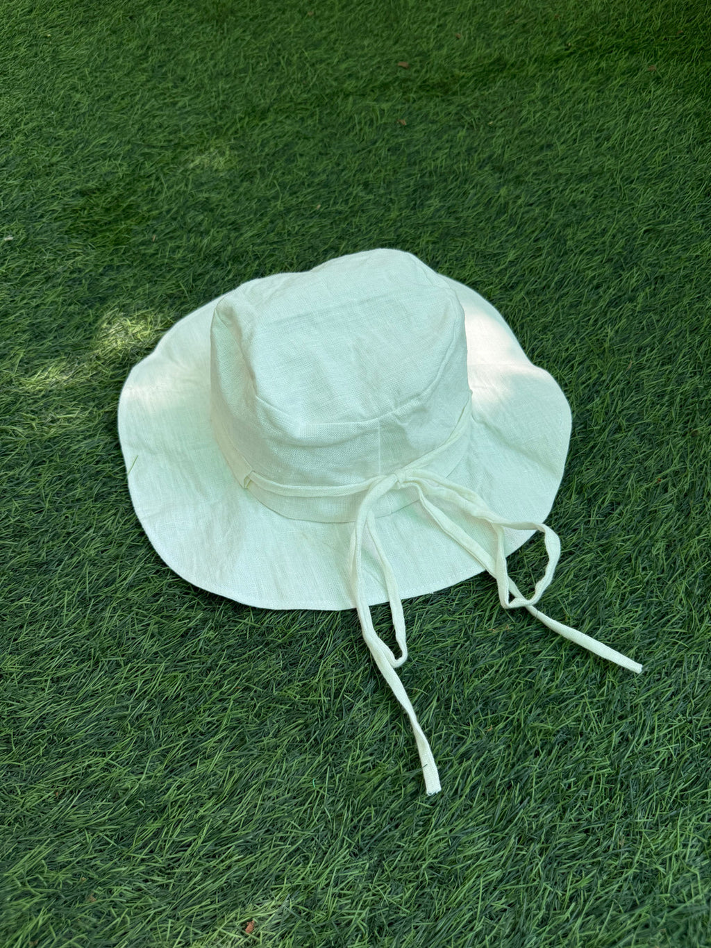 Linen white bucket hat with tie-up detail