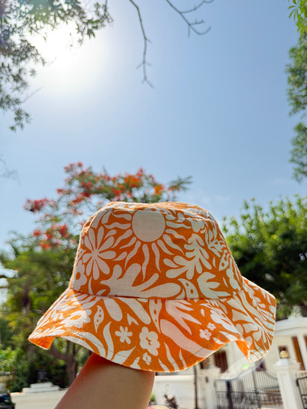 Orange and white printed bucket hat