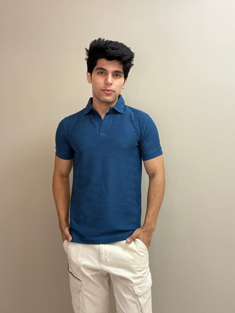 Polo T-shirt with a sun embroidery detail and textured fabric