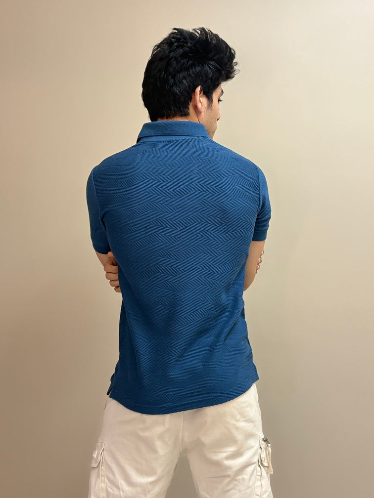 Polo T-shirt with a sun embroidery detail and textured fabric