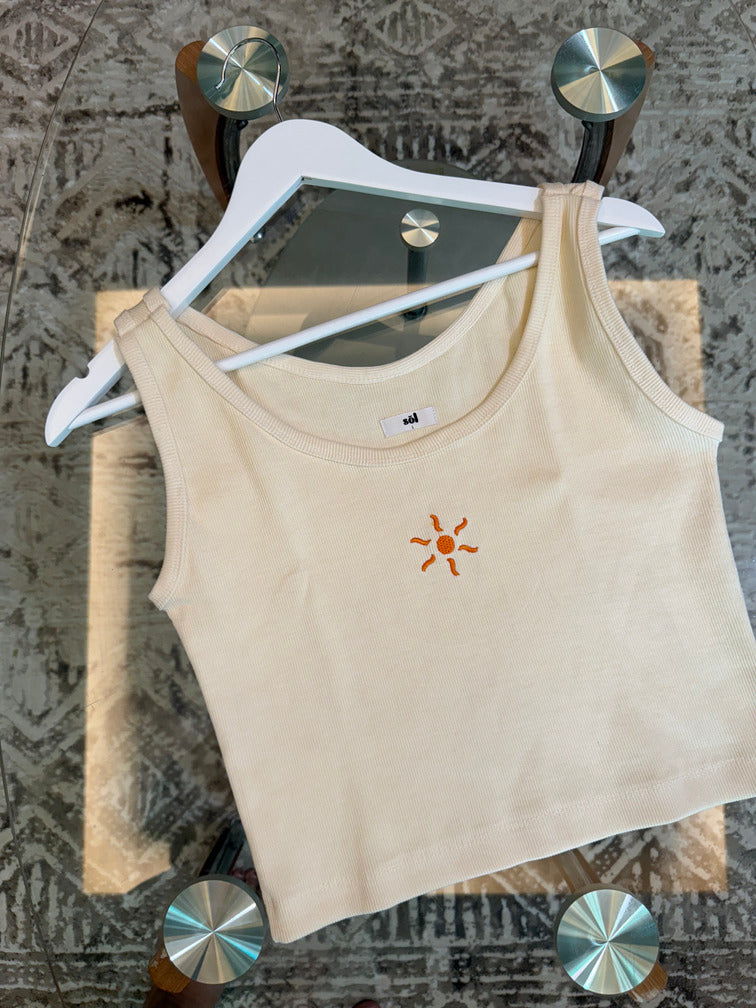 Beige tank top with a sun embroidered detail