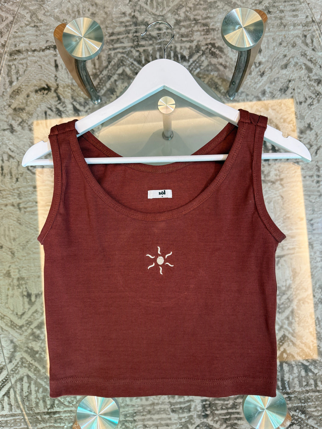 Brown tank top with a sun embroidered detail