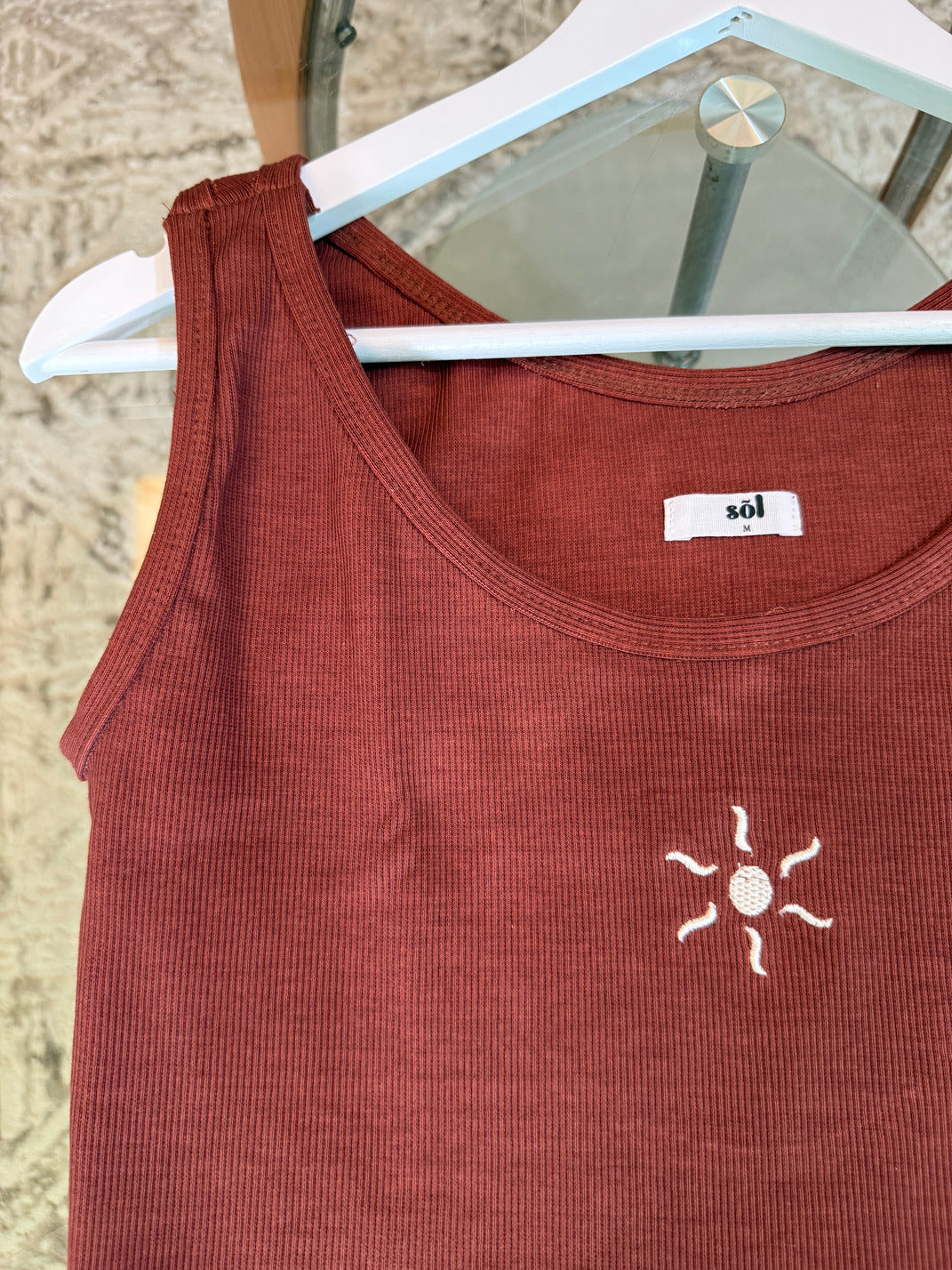 Brown tank top with a sun embroidered detail